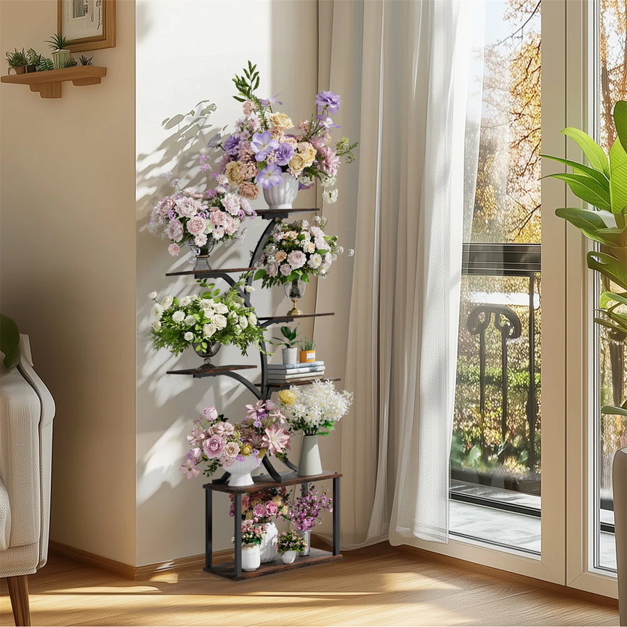 Tree-shaped 7-tier metal plant stand with assorted potted flowers near a window