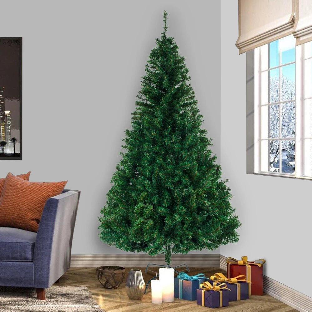 Artificial Christmas tree with full, conical green branches and metal base stand
