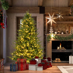 Standing pre-lit hinged artificial Christmas tree with light green needles and warm white lights