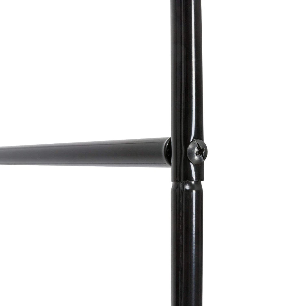 Black metal trellis arch connector joint at round steel tube intersection
