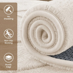 Beige shag area rug rolled up, dense plush pile with thick textured edge