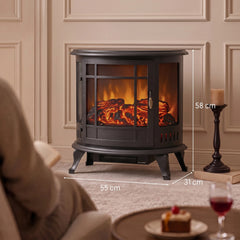 Black electric fireplace stove with glass front and realistic flame, standing on legs