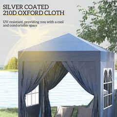Blue pop-up gazebo tent with dark draped curtains and window panels near water