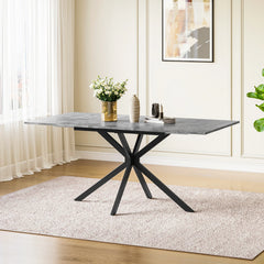 Rectangular extendable dining table with dark tabletop and black X-style legs.