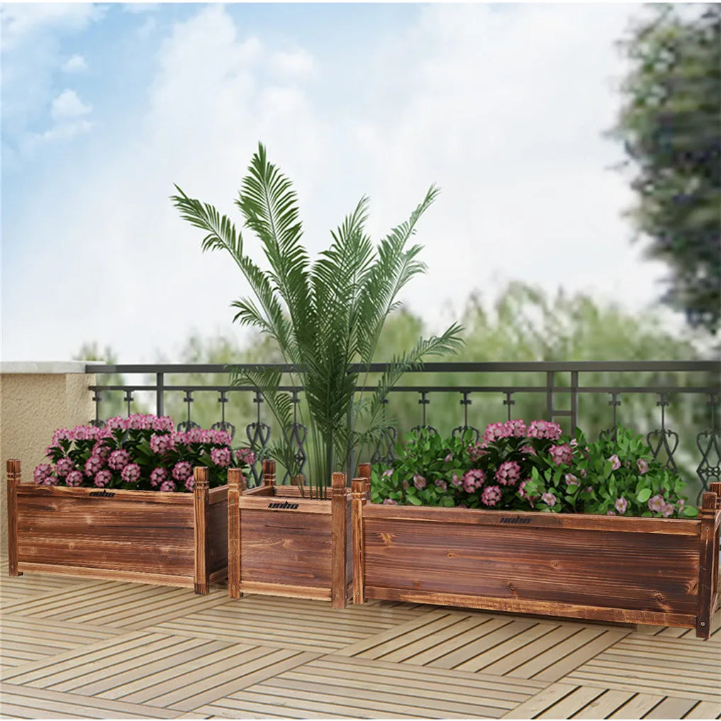 Wooden raised garden planter bed with slatted walls and top rails on outdoor deck
