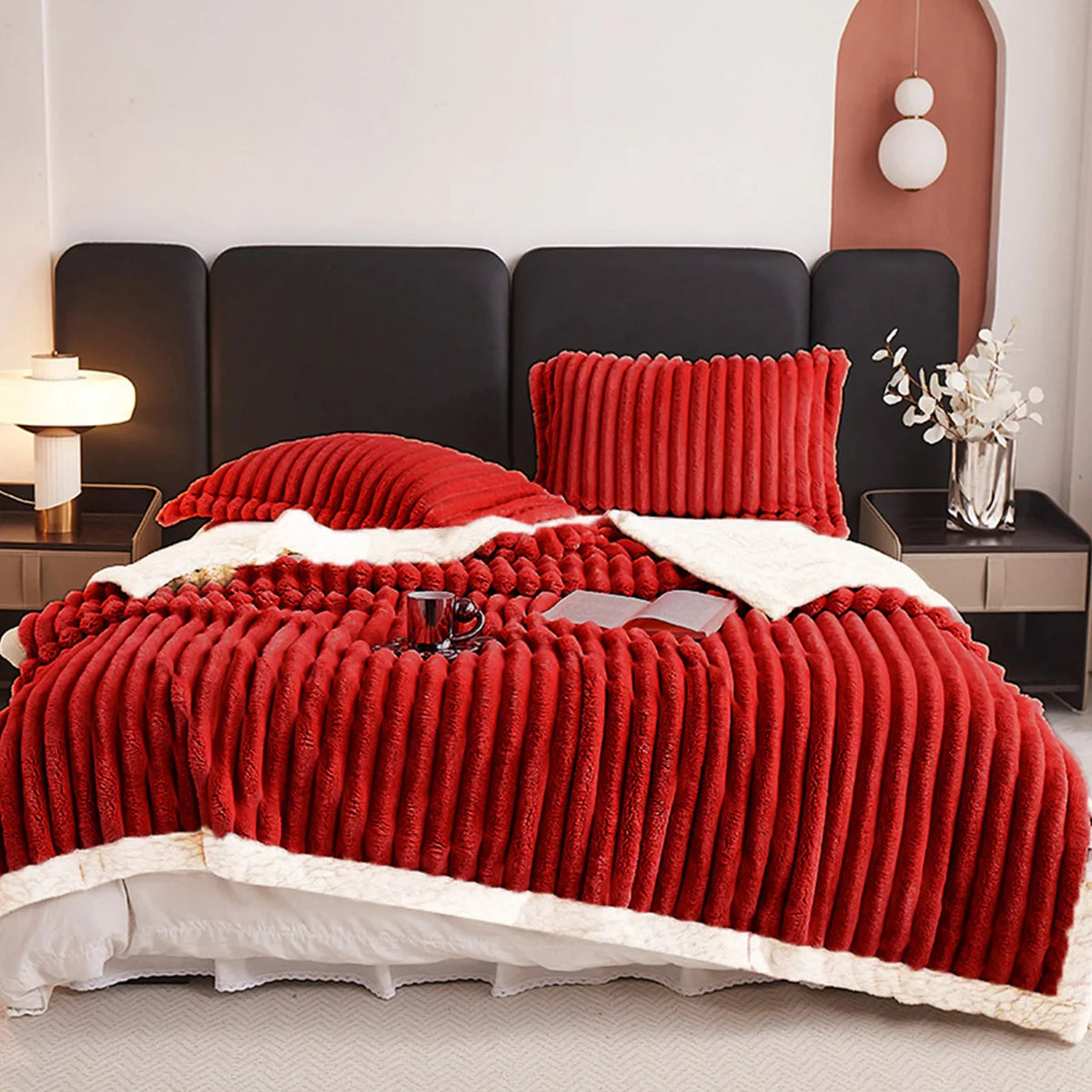 Red weighted fleece blanket with thick ribbed texture and white plush edge