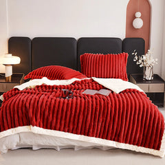 Red weighted fleece blanket with thick ribbed texture and white plush edge