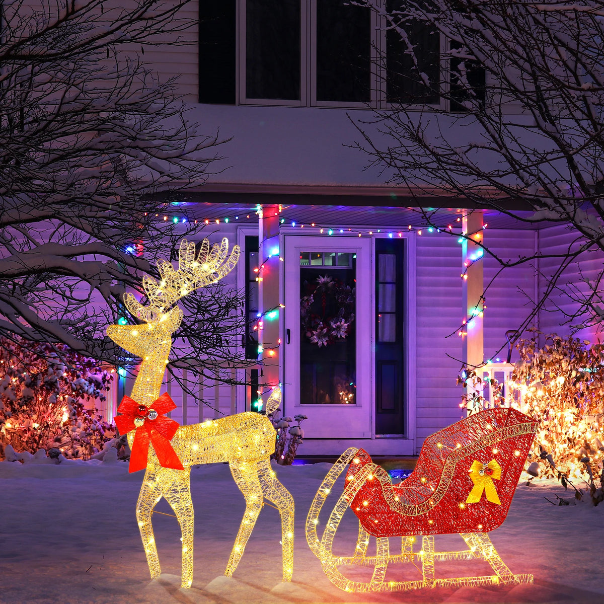 Illuminated golden reindeer with red bow and red sleigh on glowing wire lights