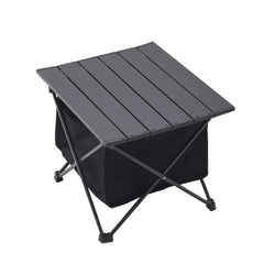 Black folding outdoor table with slatted top and storage bin, angled view