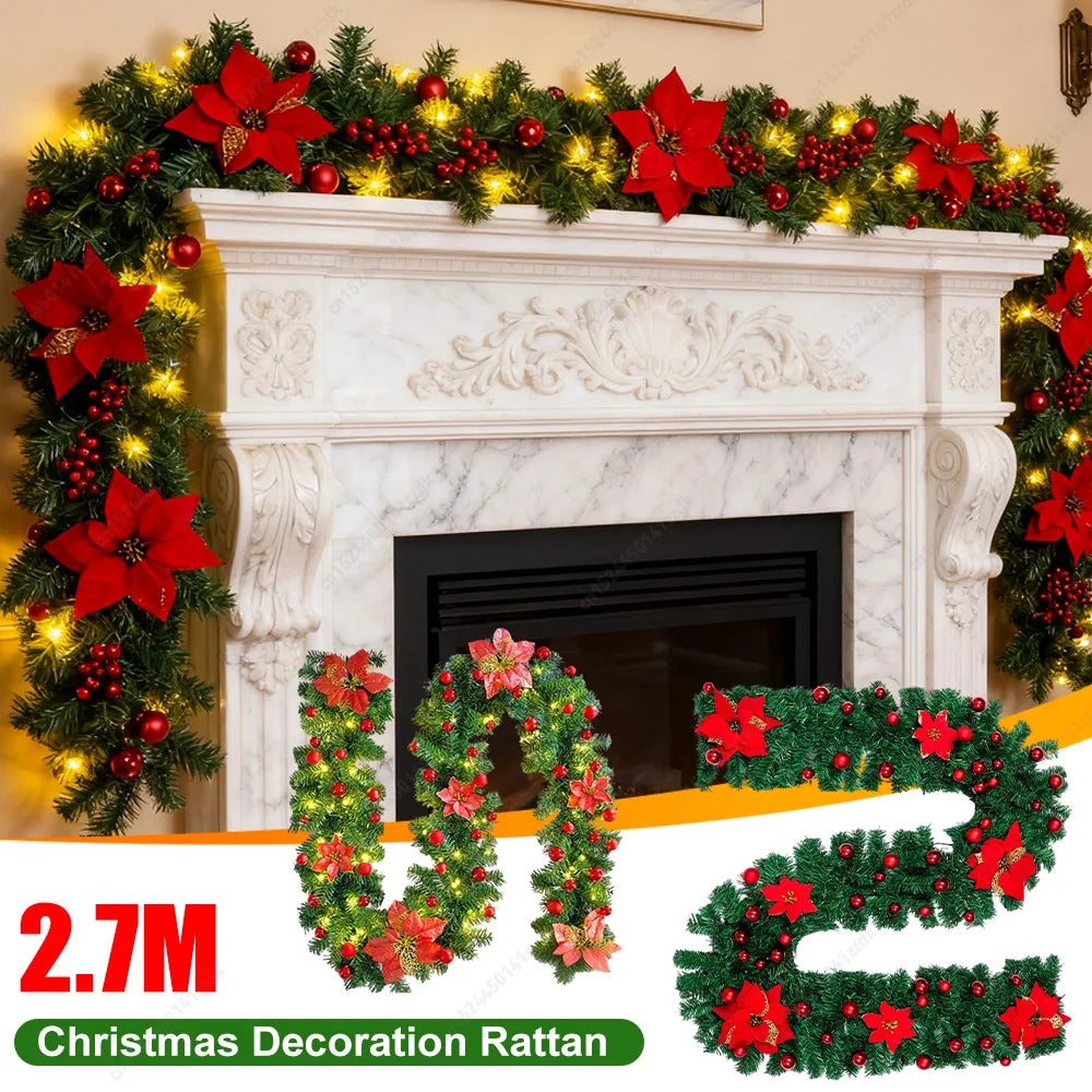 Red LED rattan garland with green foliage, poinsettias, red berries, warm lights
