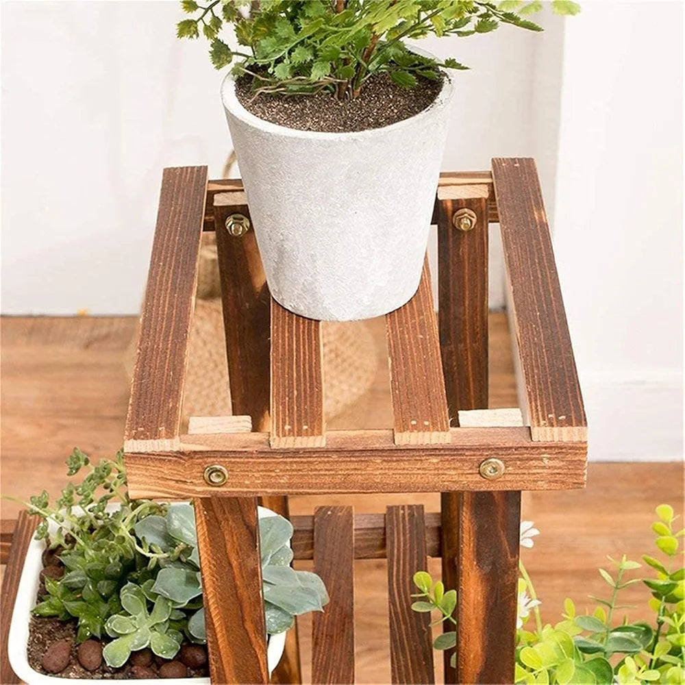 Wood plant stand top tier holding a white pot on a slatted platform