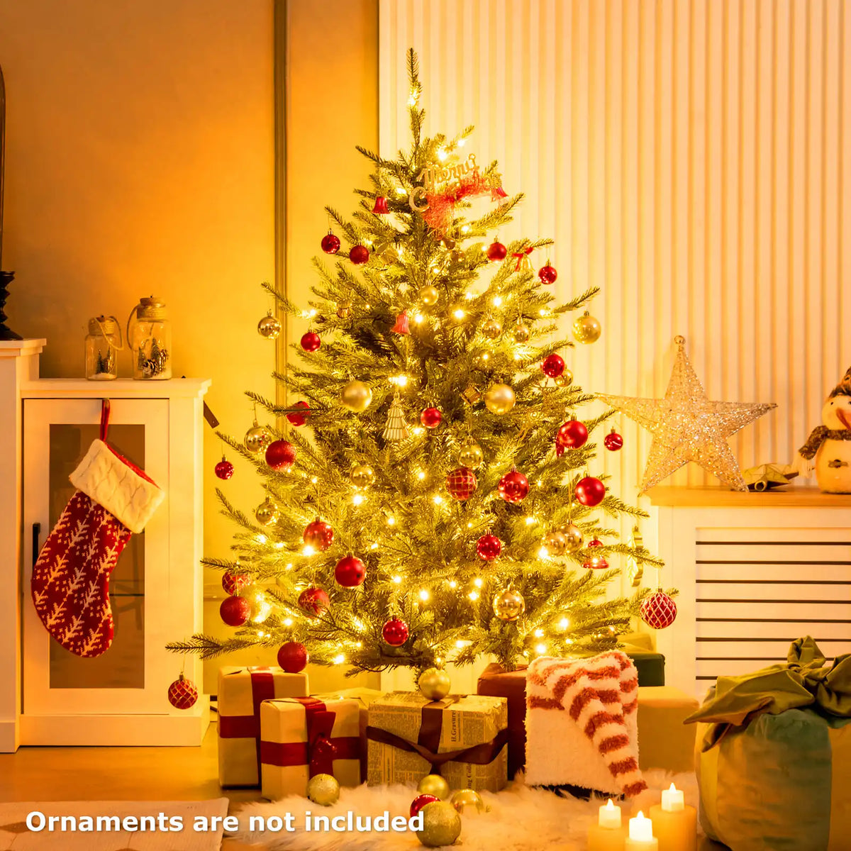 Artificial Christmas tree with warm LED lights and red and gold ball ornaments