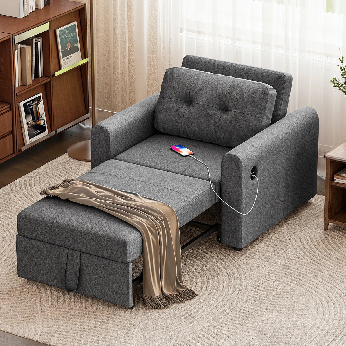 Dark grey single sofa bed chair with tufted back and pull-out seat for sleeping