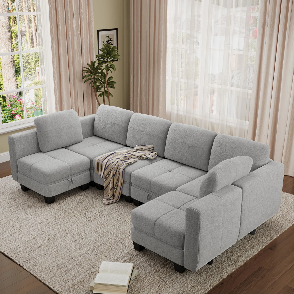 Grey modular sectional sofa with upholstered cushions and low armrests