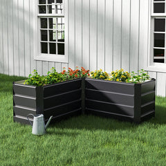 Charcoal black L-shaped metal raised garden bed with layered side panels and open top