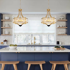 Pair of gold crystal pendant ceiling lamps with clear crystal glass drum shades on chains