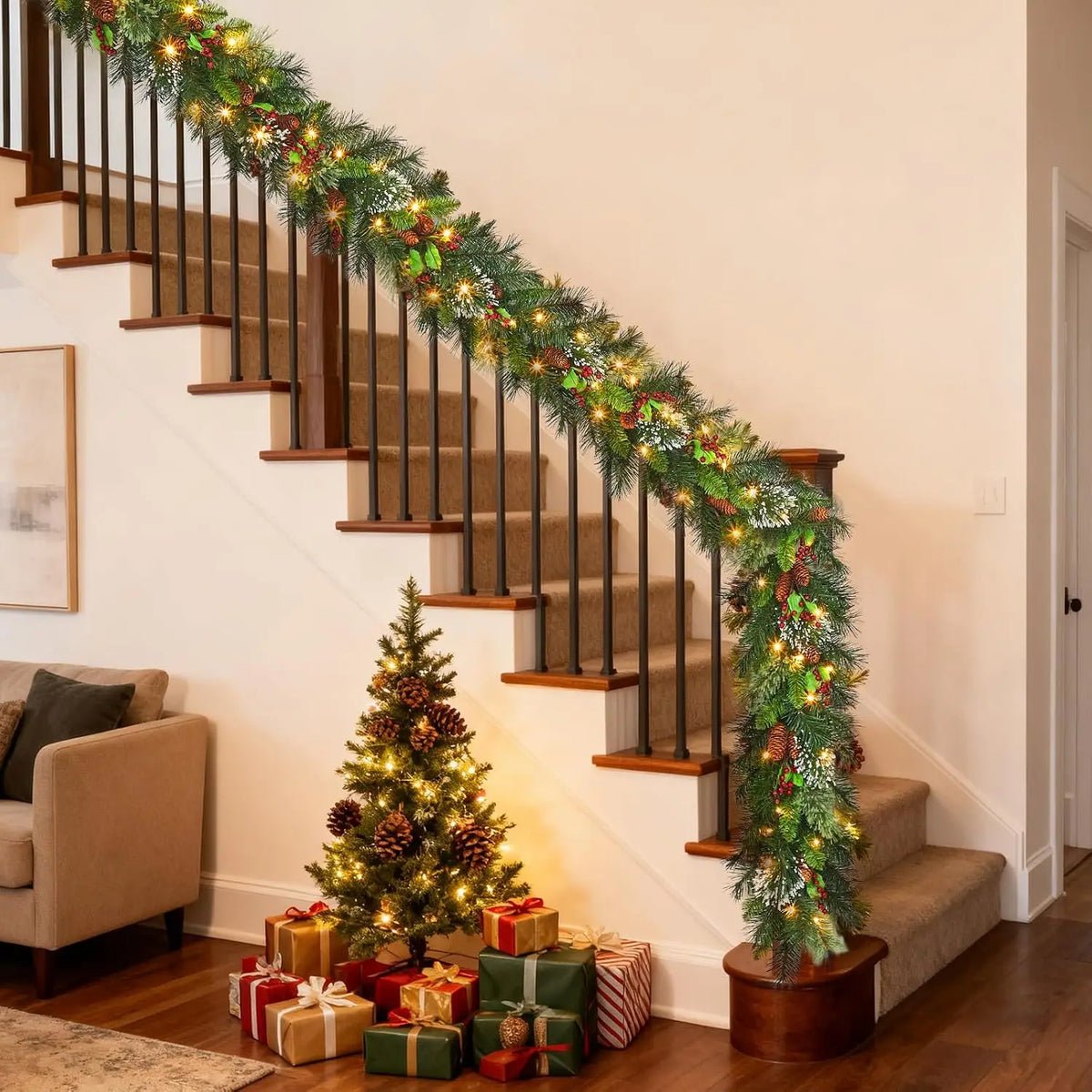 Christmas vine garland with pine greenery and warm lights along stair steps