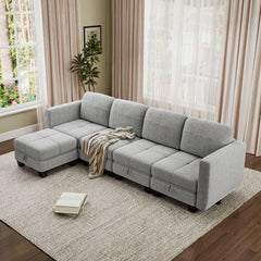 Light gray fabric sectional sofa with chaise-style ottoman and cushioned arms