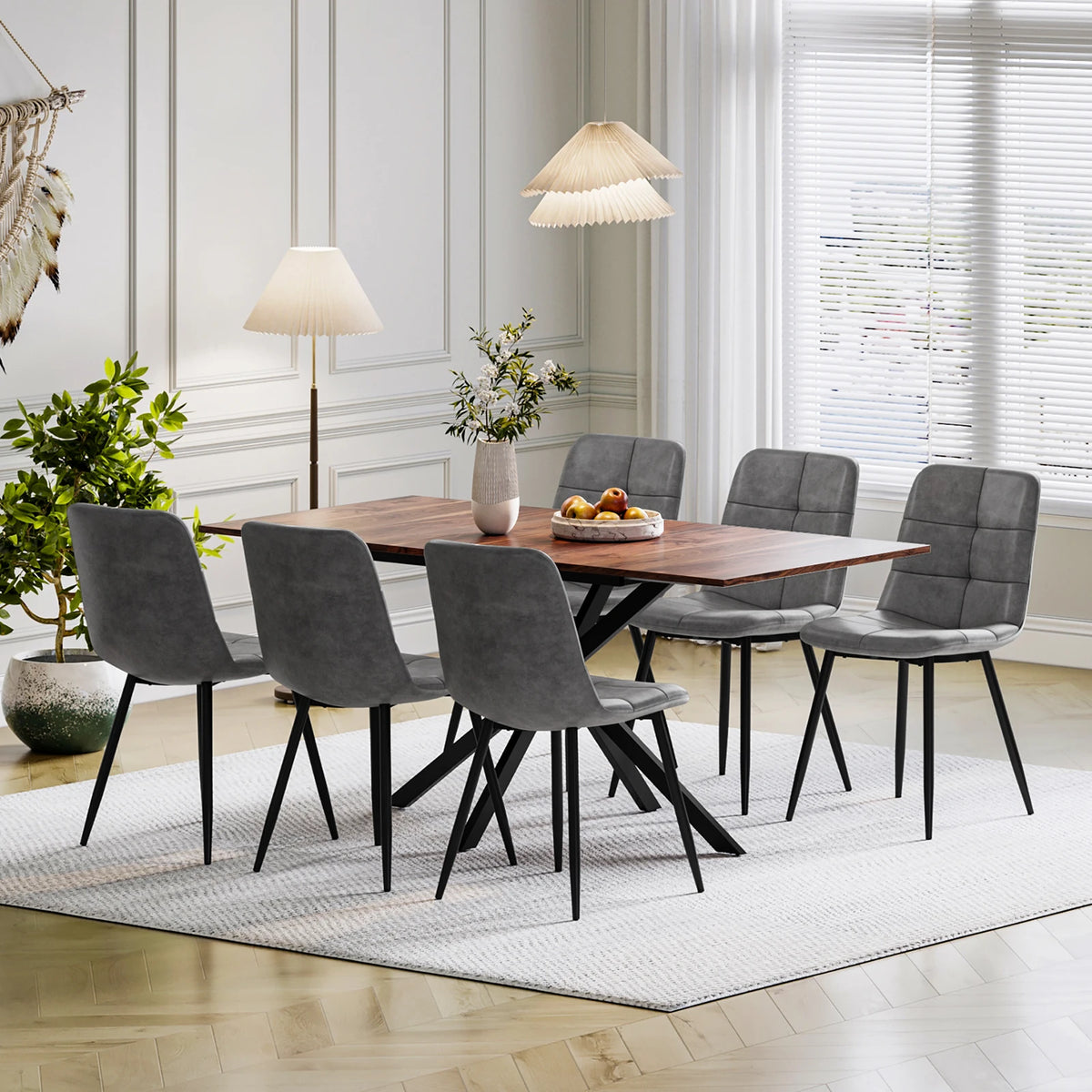Rectangular extendable dining table with dark wood top and 6 upholstered gray chairs