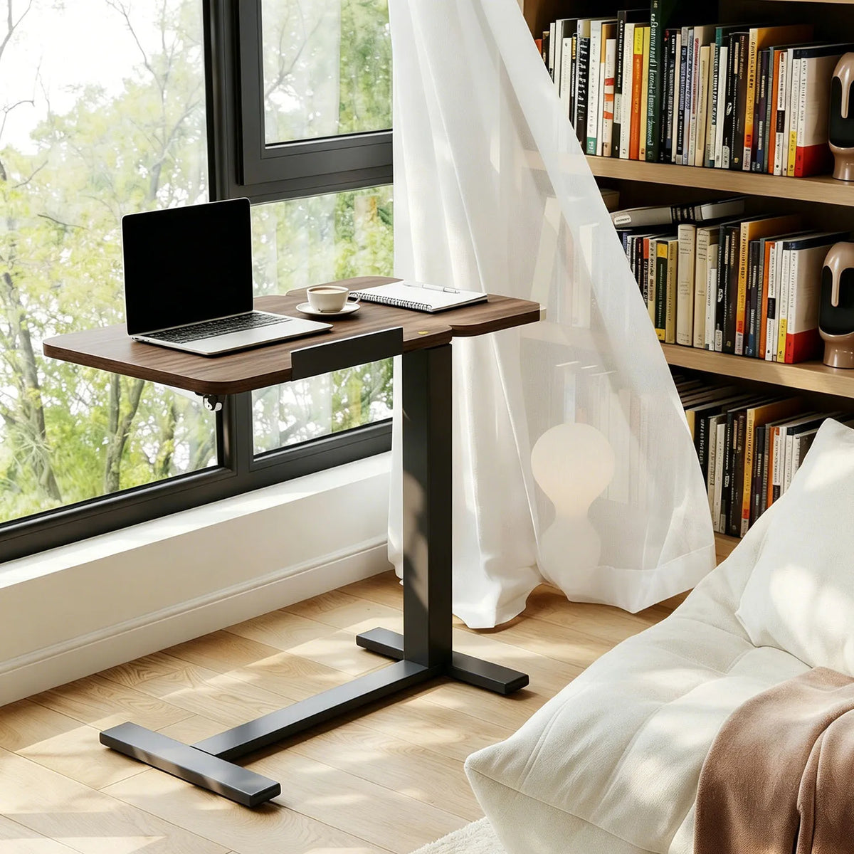 Adjustable rolling overbed table with tilting dark desktop and black metal base